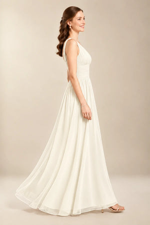 Chantel Ivory chiffon wedding dress, side view of flowing floor-length skirt